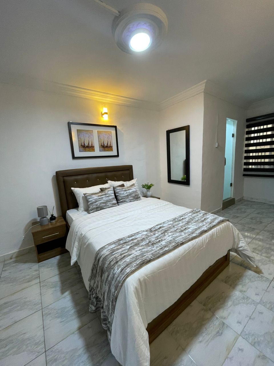 Modern contemporary bedroom at Wolban Short Lets